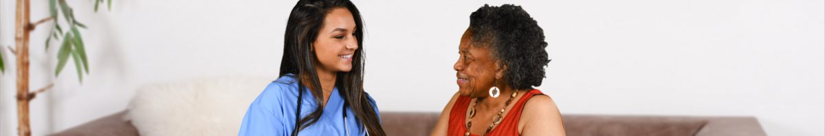 caregiver and a senior woman talking